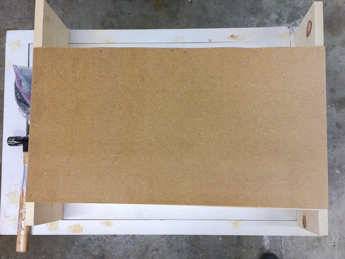 Attaching back of the kids table with book storage