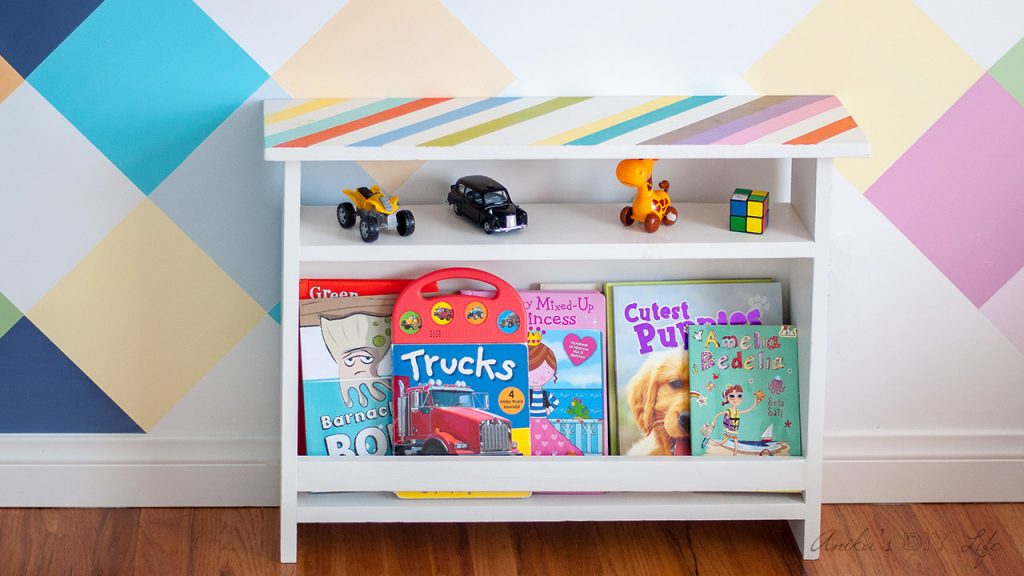 This DIY Kids bedside table combines function and style. This kids furniture has book storage for easy access to bedtime reading. Add organization to the kids' room with this easy beginner woodworking project!
