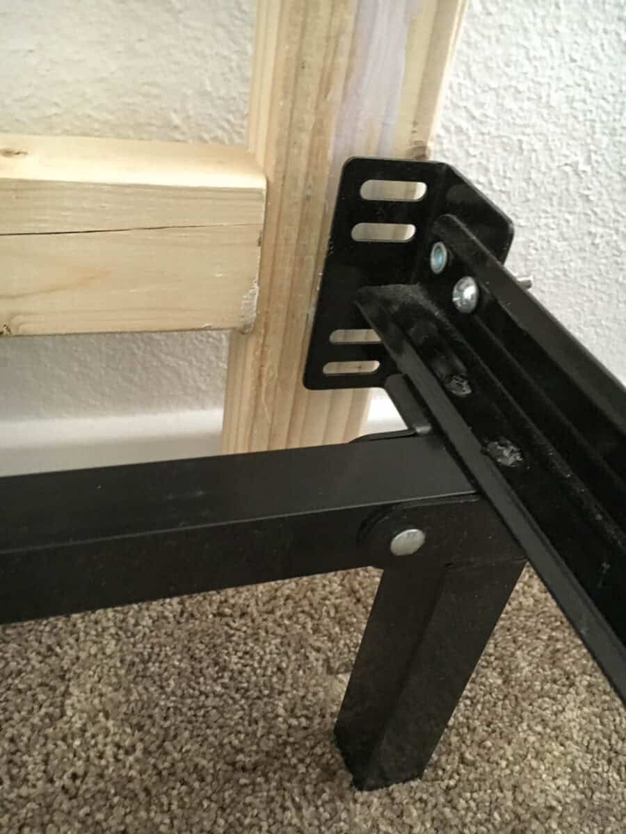 Attaching the bed frame to the headboard.
