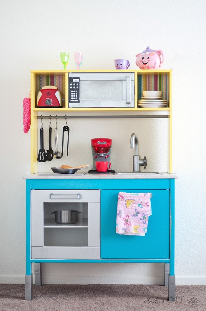 Ikea Duktig makeover using colorfule paint and scrap book paper