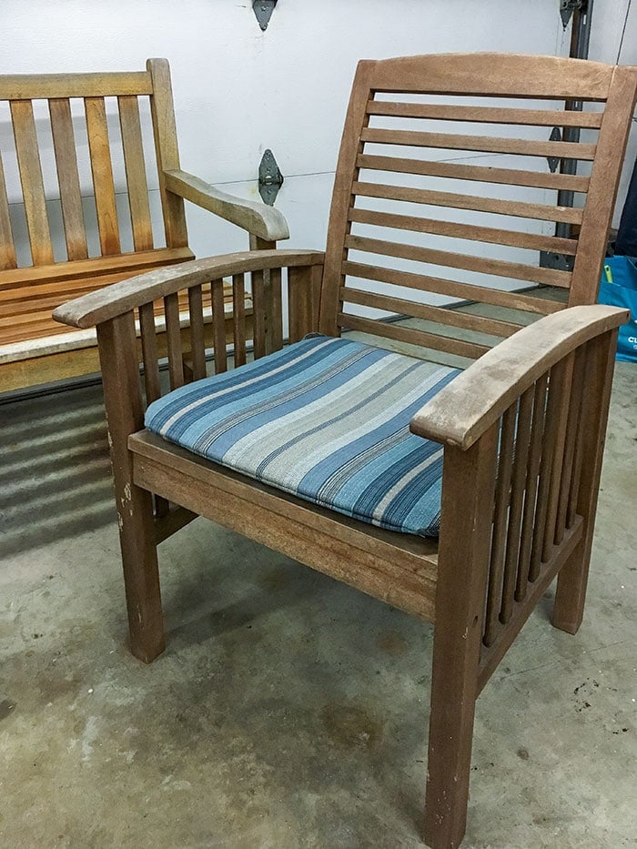 Close up of old beaten up patio chair