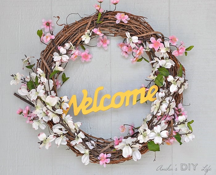 Make an easy and gorgeous DIY Spring wreath for under $15. Reuse a grapevine wreath for every season!