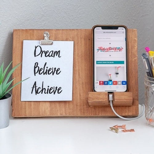 Brown DIY phone holder with phone and quote in a clip