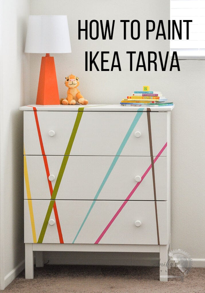 White painted Ikea Tarva with colorful stripes and text overlay