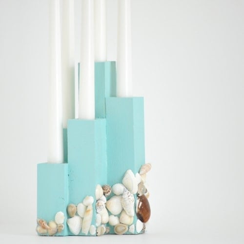 This DIY coastal candle holder brings the right touch of beach to your decor and makes a great centerpiece!