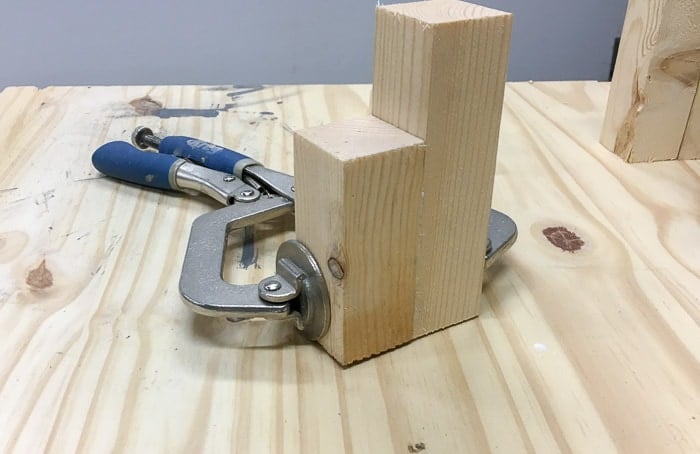 Clamping wood scraps to make scrap wood candle holder