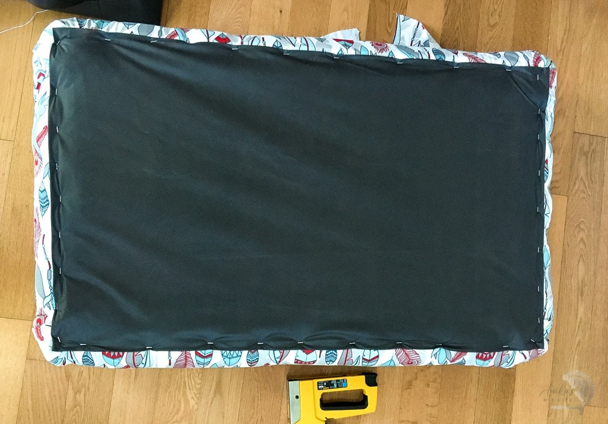 Finished top of stapled with black fabric