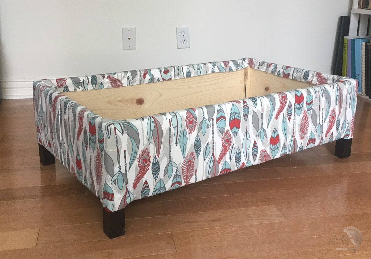 base of the ottoman upholstered.