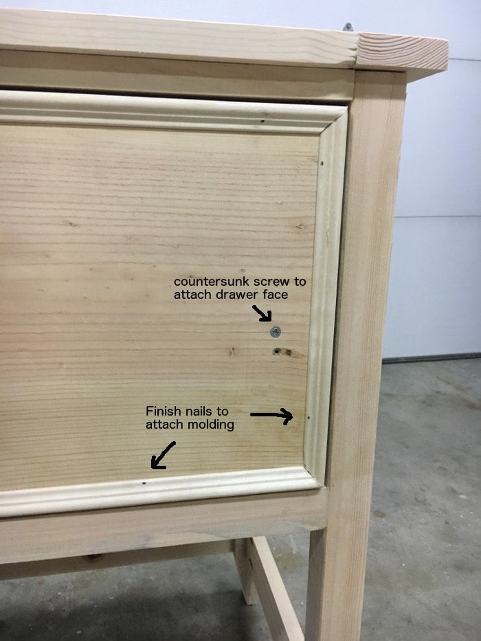 DIY Mirrored Console table- attach molding to the drawer faces