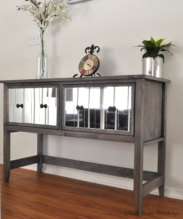 Build your own DIY mirrored console table! Step by step tutorial shows how easy it is to make this amazing high end looking DIY sideboard