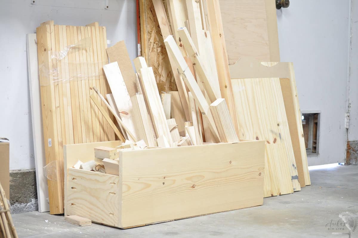 side view of the scrap wood organization bin filled with various sized boards.