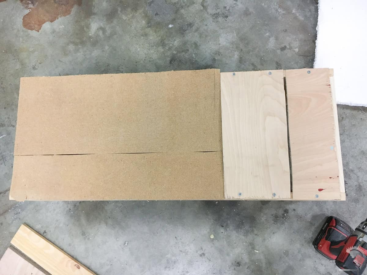 bottom of the scrap wood bin with 1/4" boards attached with screws