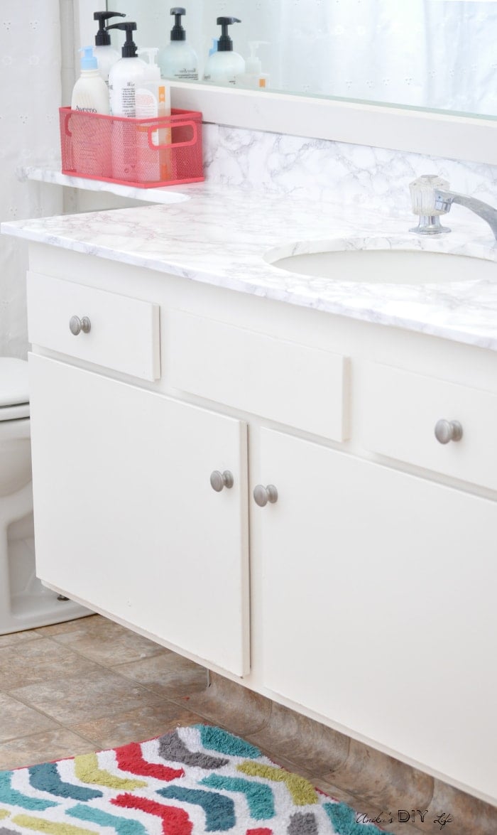 This contact paper countertop before and after will blow you away! It is the perfect budget-friendly solution for any rental bathroom and kitchen.
