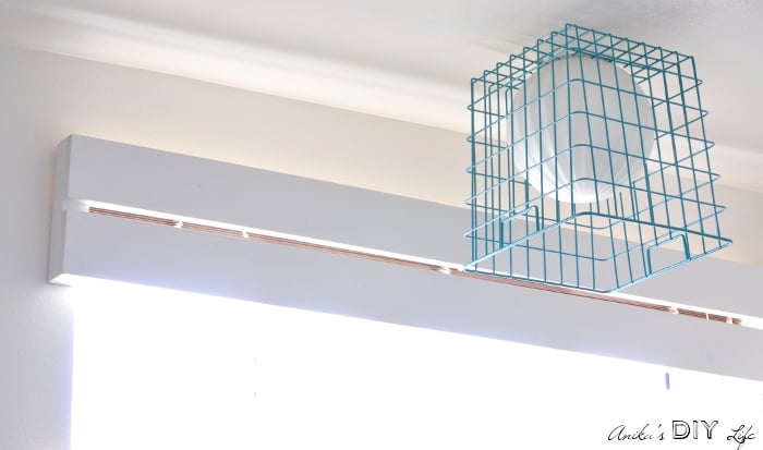 Super easy wood valence and basket lamp shade for kids bathroom makeover.
