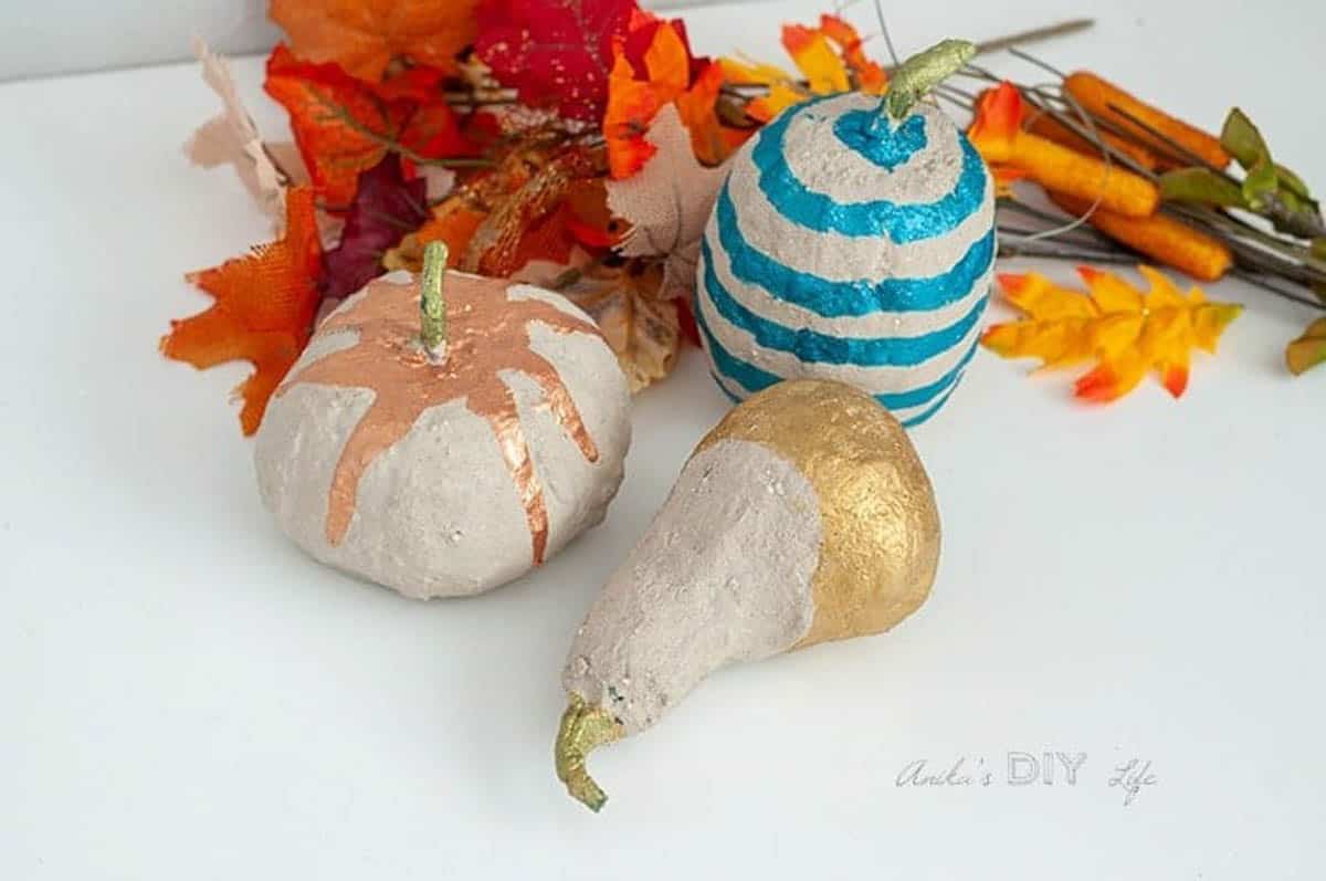 Dollar store pumpkins covered in concrete