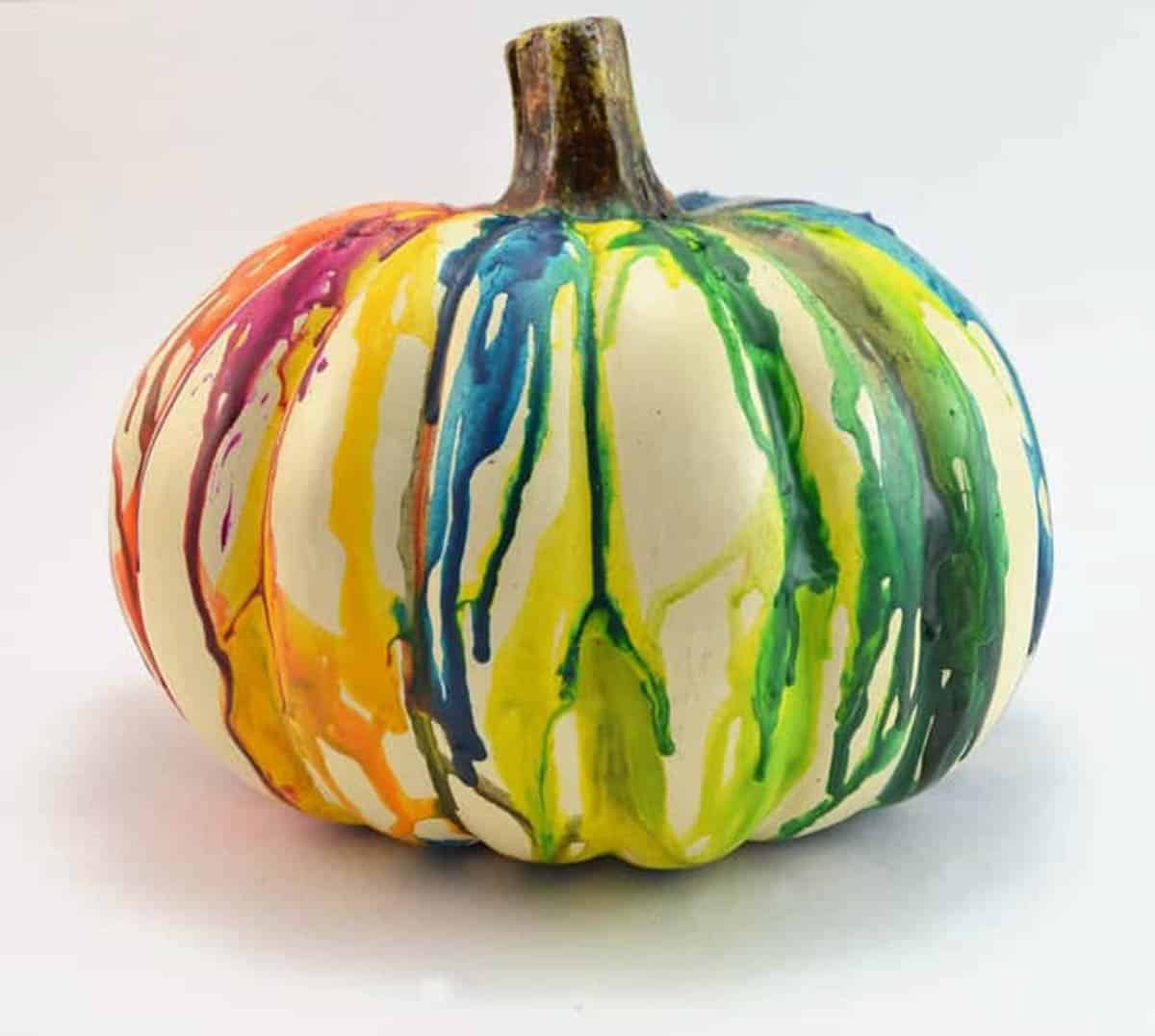 Melted crayon in different colors on a pumpkin