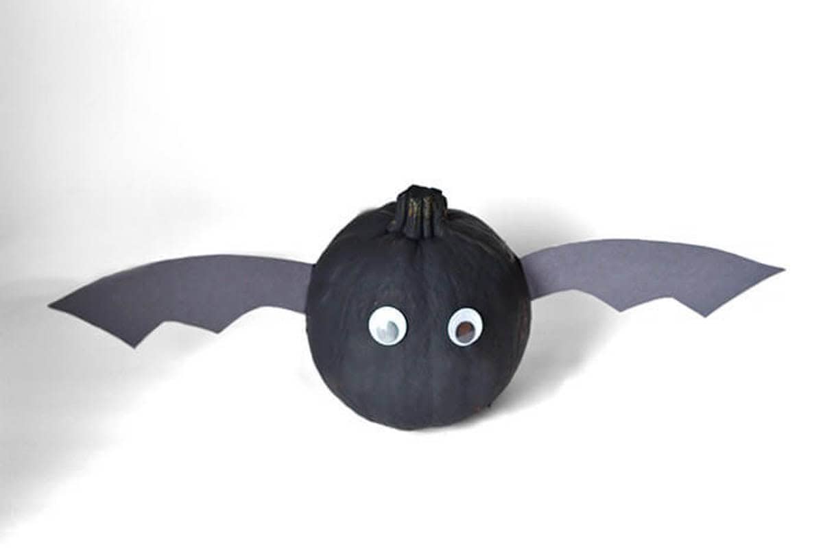 A pumpkin decorated as a bat