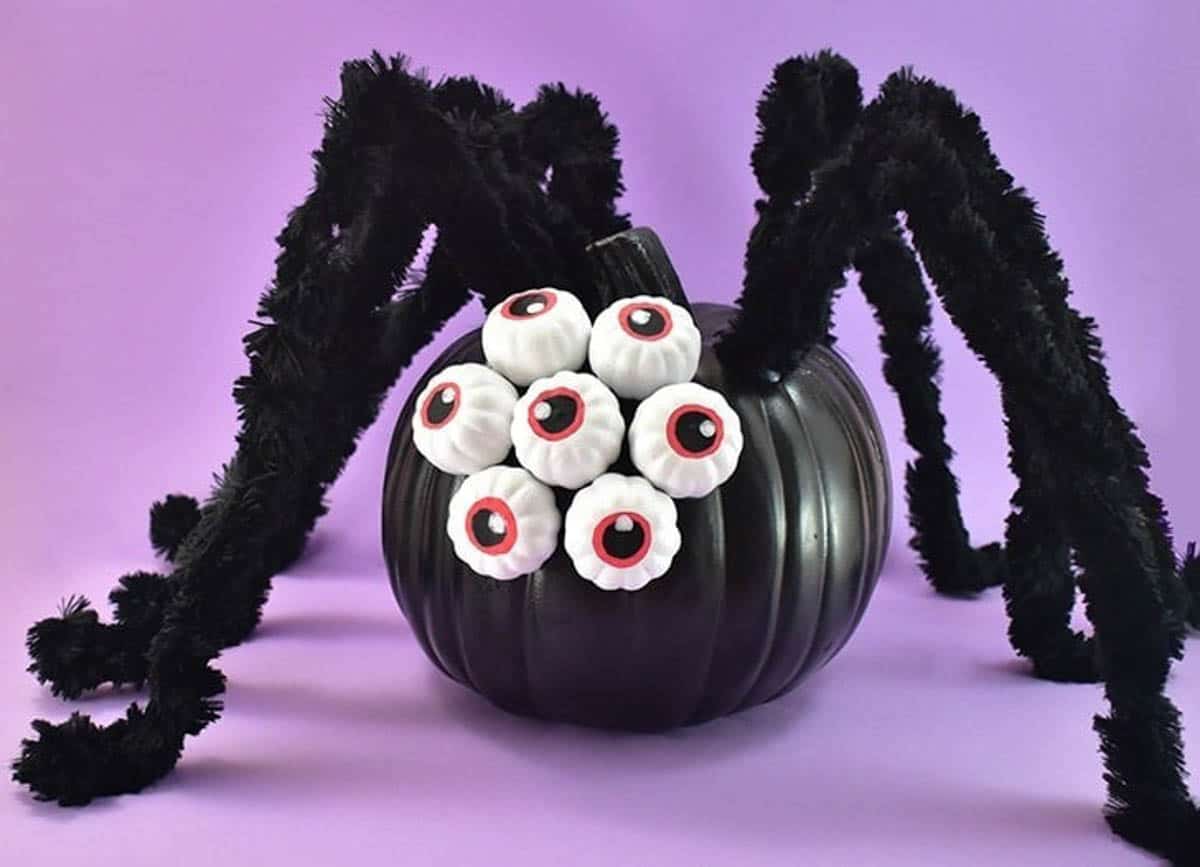 no carve pumpkin decorated as a spider