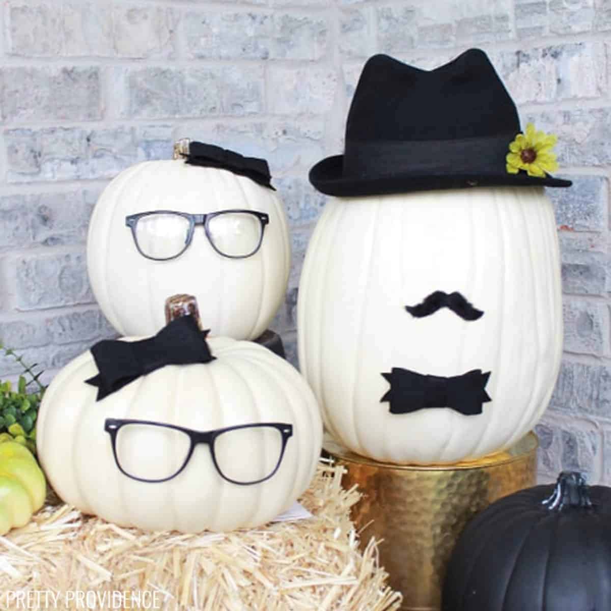 White pumpkins with faces