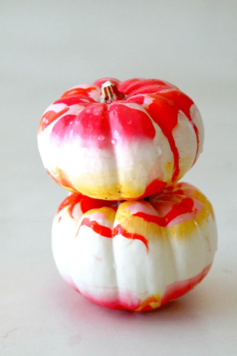 bright colored mini pumpkins painted with fingernail polish