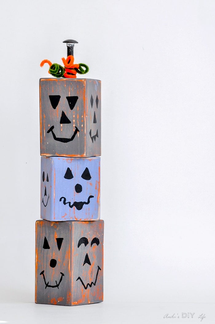 DIY wood block pumpkins that are stackable and distressed. Easy to make!