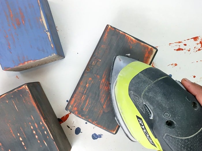 She creates cute fall decor with this! How to make wood block pumpkins