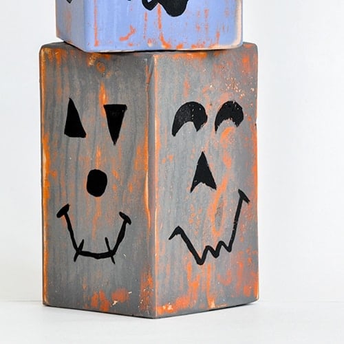 DIY Wood pumpkins that are distressed and stackable make perfect fall decor! Add a fun shabby chic vibe to your fall decor with wood block pumpkins!
