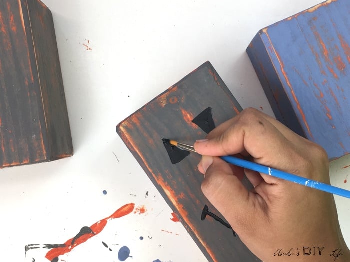 Painting distressed DIY wood pumpkins