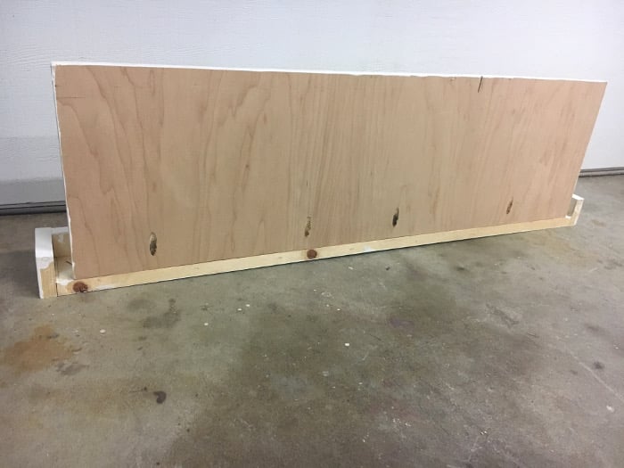 Make a DIY shelf with towel hooks