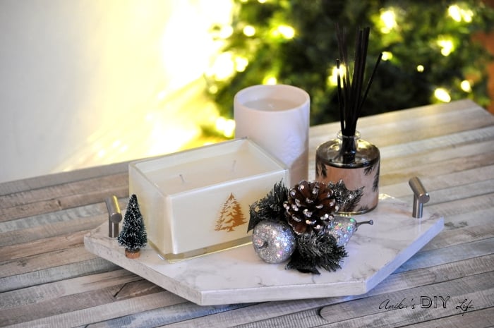 She made this DIY hexagonal marble tray out of wood! What a perfect centerpiece or serving tray!
