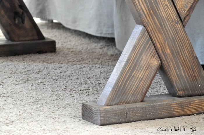 Close up custom stained bench legs