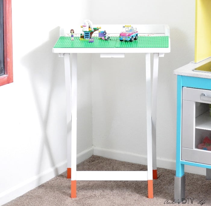 Portable DIY Lego table. An old TV table makeover never looked so cute!