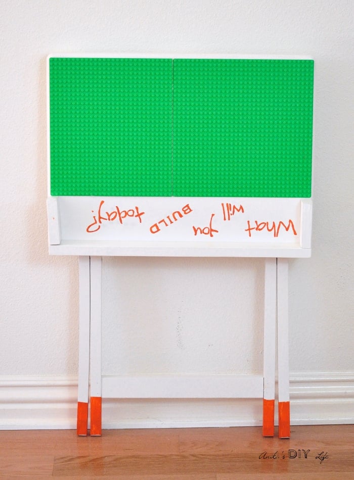 A portable DIY Lego table that can be folded and stored when not in use. An old TV table makeover doesn't get any cuter!