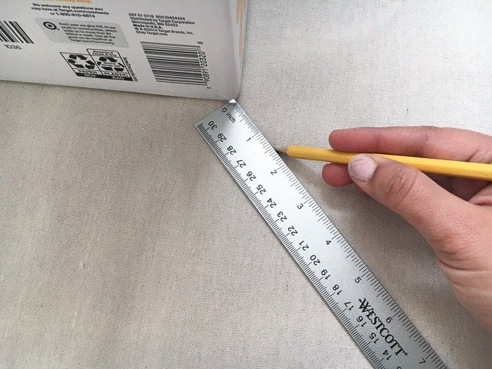How to make perfect no-sew canvas storage bins by wrapping cardboard boxes in drop cloth. This is a fun easy drop cloth organization project