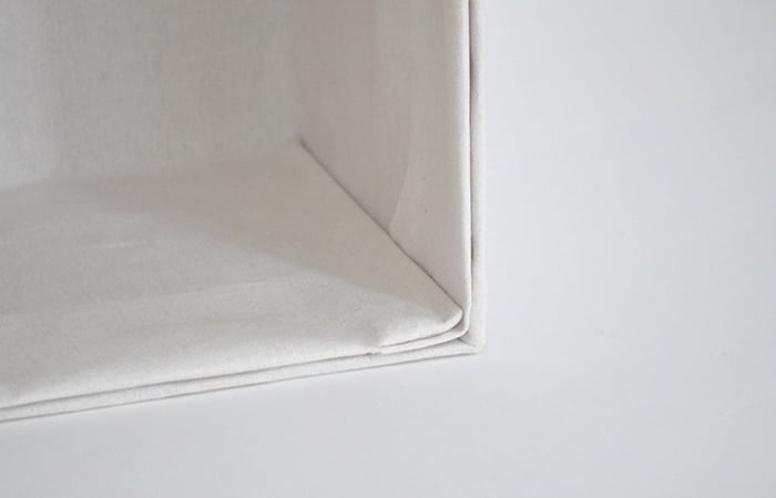 How to make perfect no-sew canvas storage bins by wrapping cardboard boxes in drop cloth. This is a fun easy drop cloth organization project