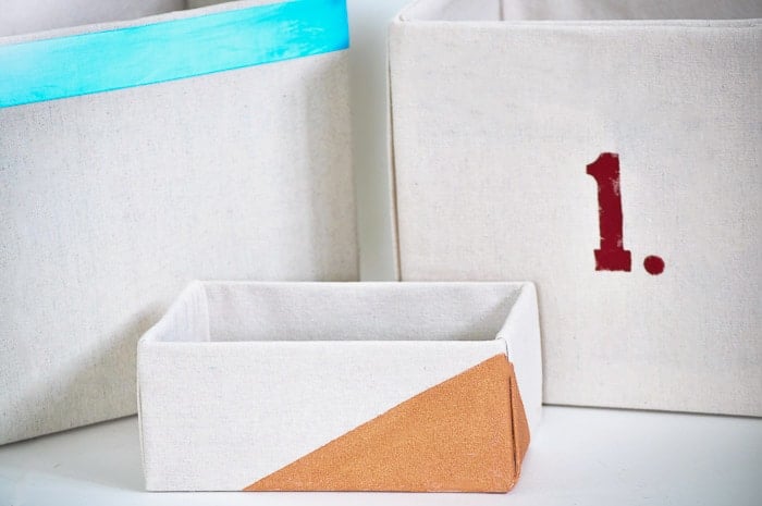 How to make perfect no-sew canvas storage bins by wrapping cardboard boxes in drop cloth. This is a fun easy drop cloth organization project