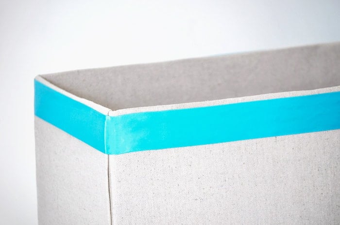 How to make perfect no-sew canvas storage bins by wrapping cardboard boxes in drop cloth. This is a fun easy drop cloth organization project