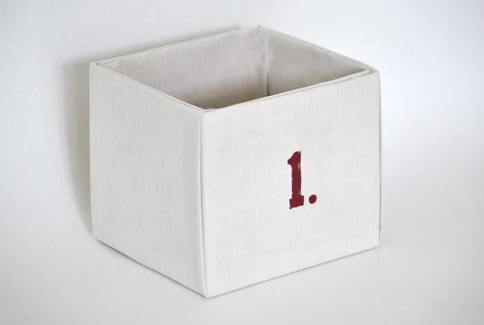 How to make perfect no-sew canvas storage bins by wrapping cardboard boxes in drop cloth. This is a fun easy drop cloth organization project