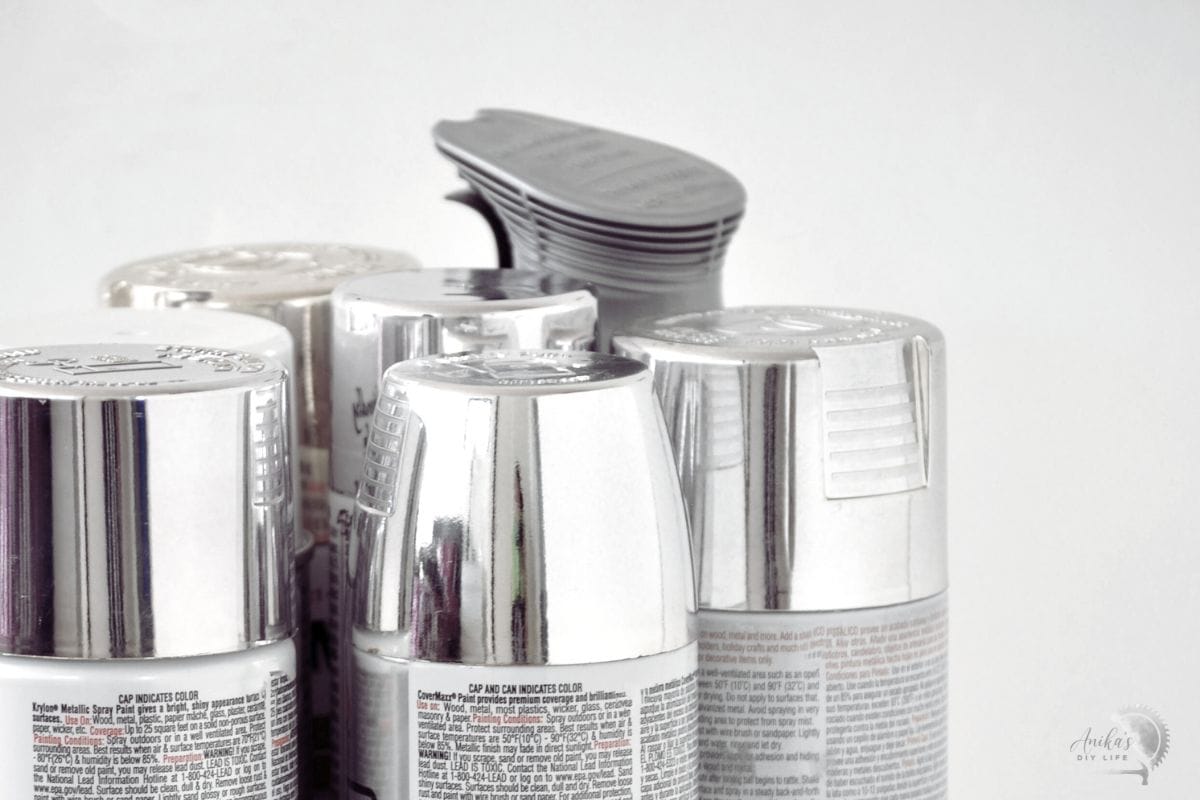 Close-up of top of best silver spray paint cans