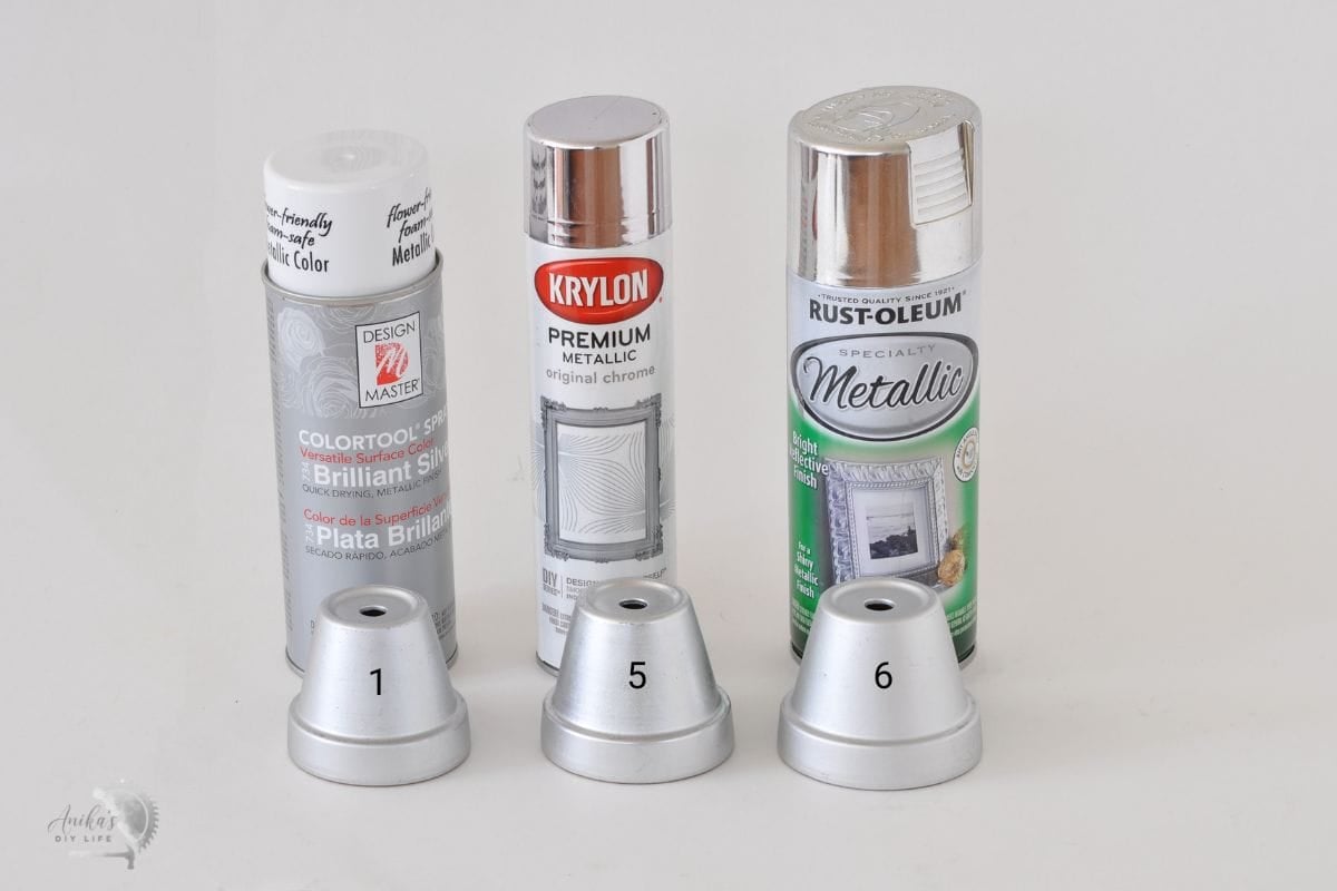 3 silver spray paint cans with silver paint plant pots labeled 1,5, and 6