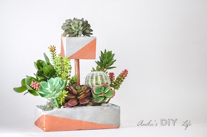 Tiered DIY Concrete planter with copper pipe and paint.