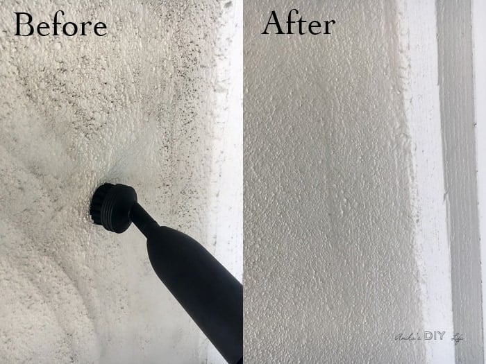 Cleaning a front porch wall with steam cleaner