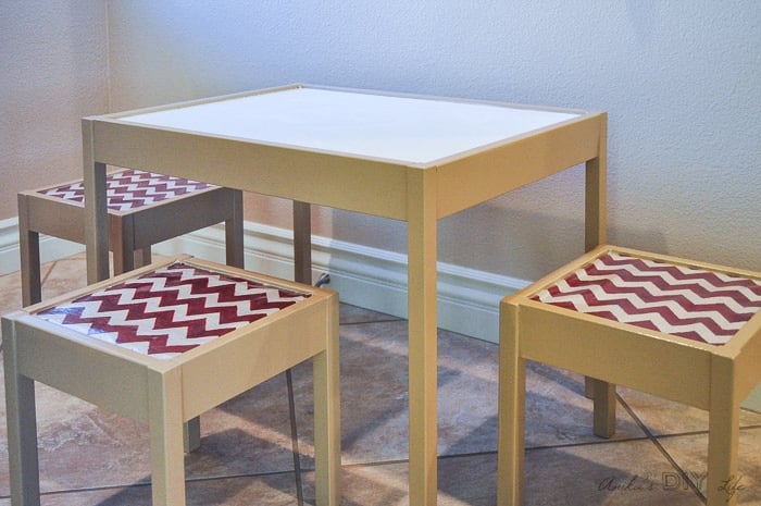 Love this easy fabric covered Ikea Latt hack. Make stools out of the chairs! Genius!