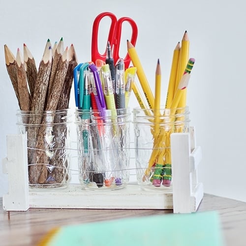 Easy DIY Mason Jar Desk Organizer Idea using scrap wood and floral wire. Create desk storage and organization with this full step by step tutorial.