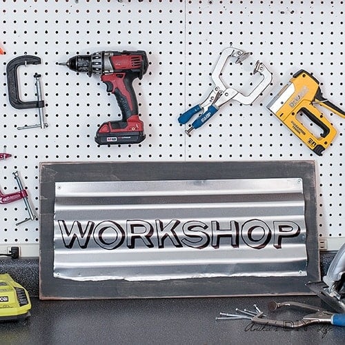 This custom industrial sign is so easy and quick to make! Add lots of character with this easily personalized rustic metal sign to your workshop or home!