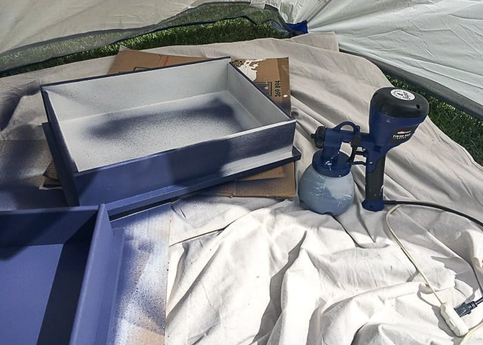 Painting drawer using a paint sprayer