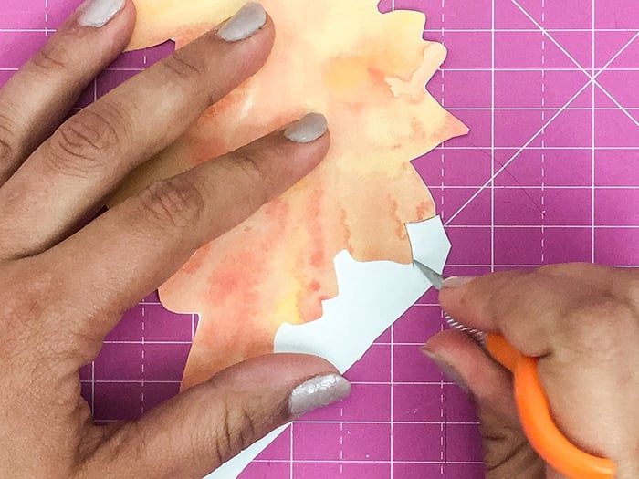 She cuts the pretty dinosaurs to make even prettier wall art!
