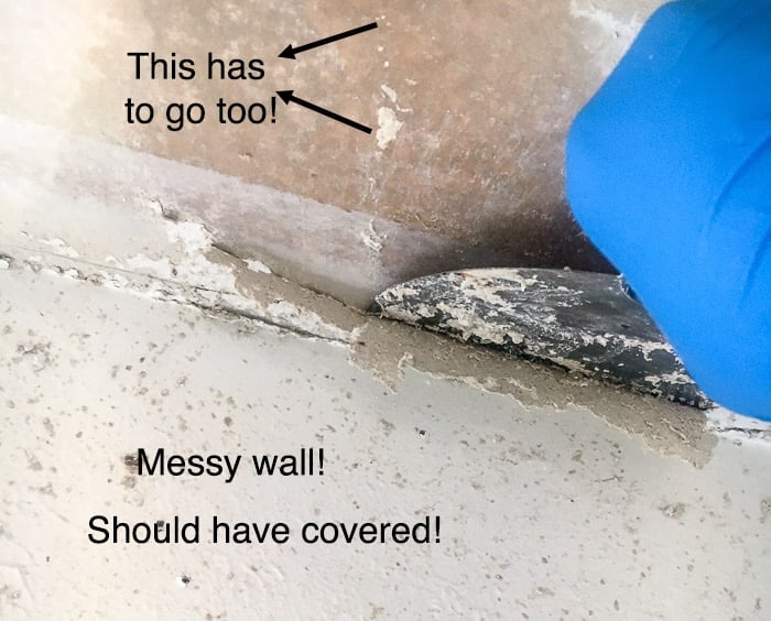 removing popcorn ceiling using a putty knife