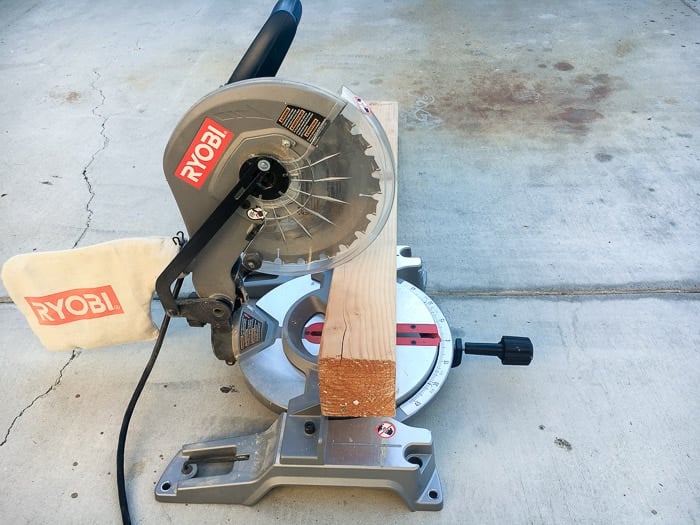 Cutting 4x4 into 3 pieces for DIY wood block snowman.