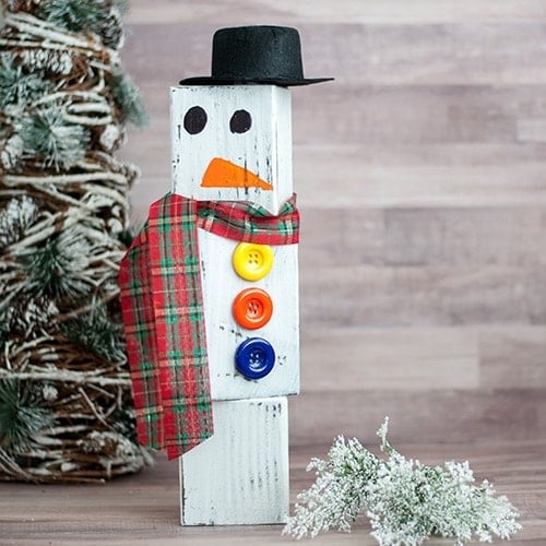This DIY wood block snowman is a super easy and cute Christmas decor idea! This snowman made from wood is easy to store and use every Christmas and winter!